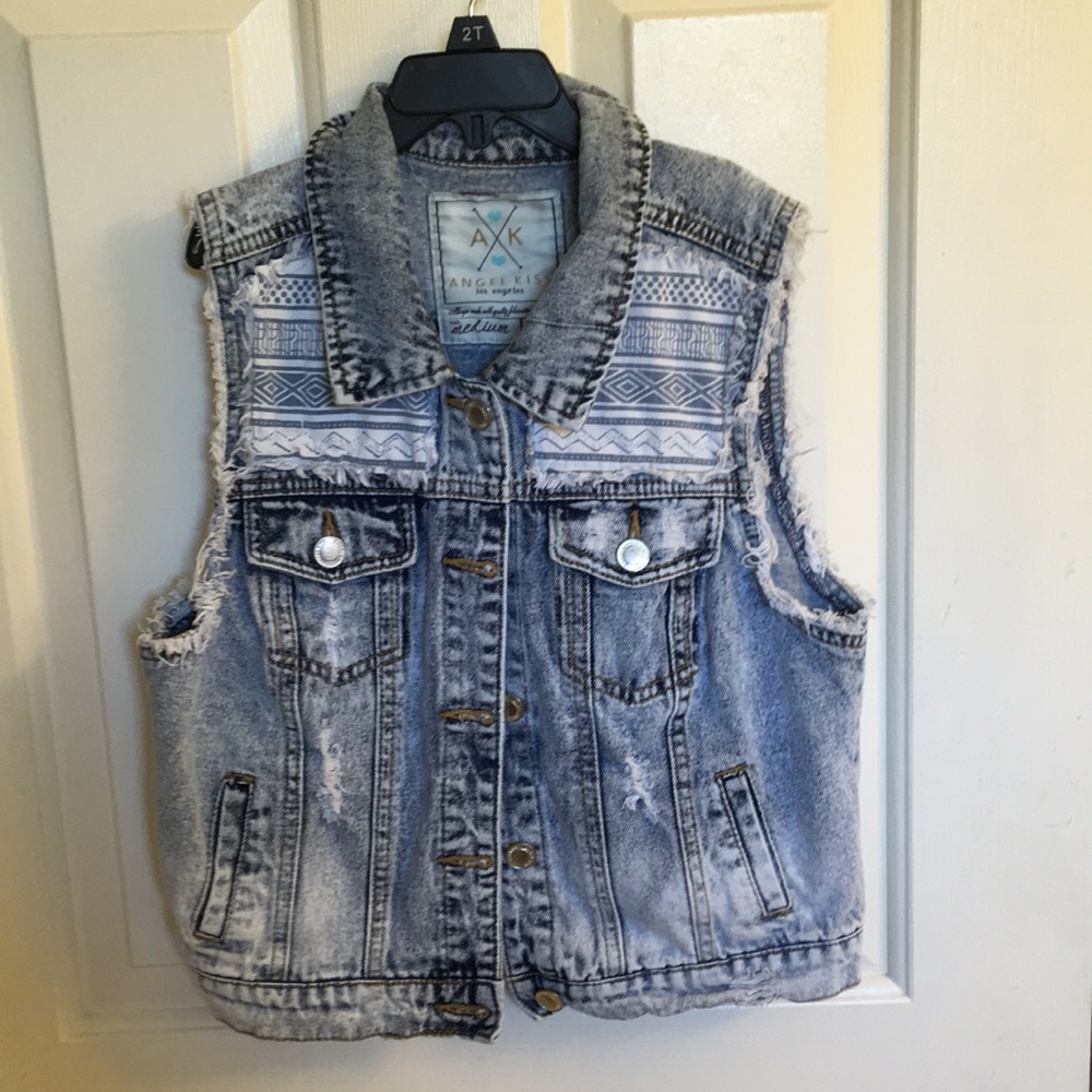 A sleeveless jean jacket